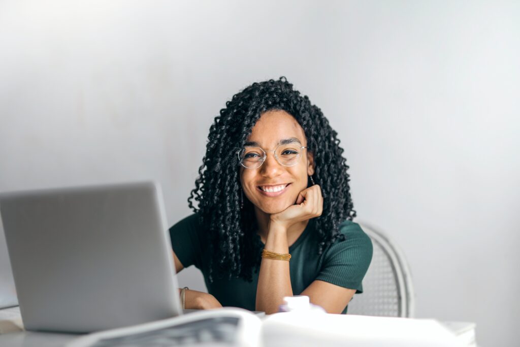 Girl smiling while using her laptop