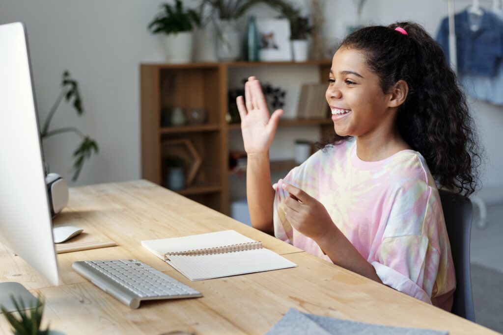 Middle school girl engaged in a virtual computer science lesson